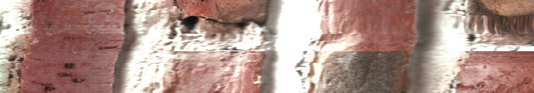 Piezas rojizas y juntas claras forman una secuencia que ondula con el escaneo.
