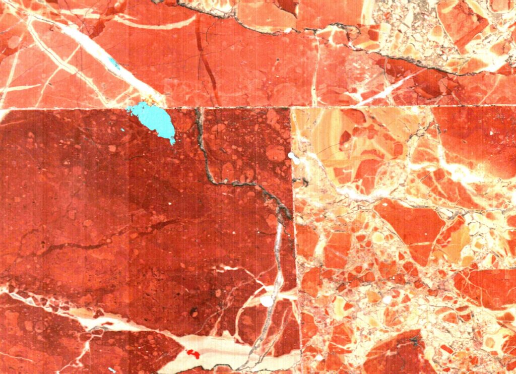 Una trama roja y blanca queda interrumpida por una pequeña señal turquesa.