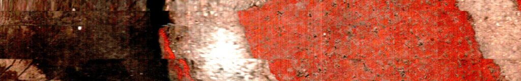 Una división clara separa superficies rojizas de distinta textura.